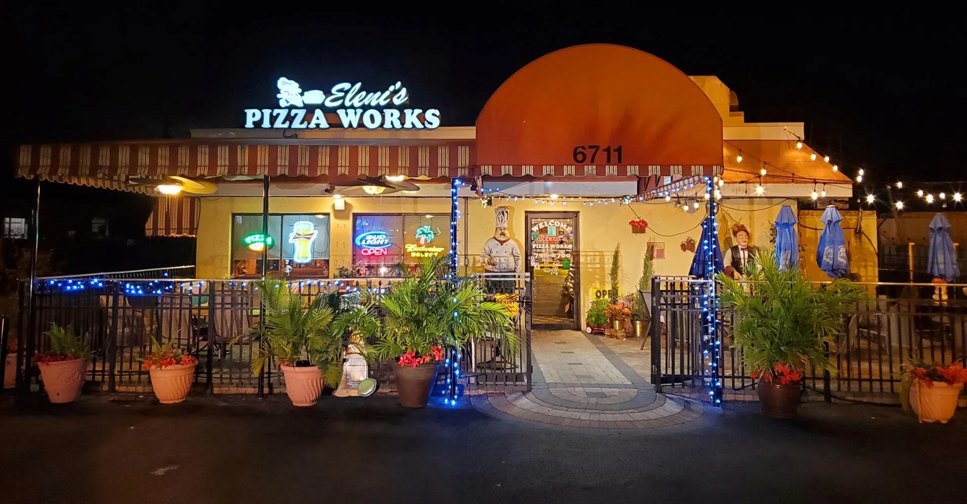 Eleni's Pizza Works restaurant exterior at night