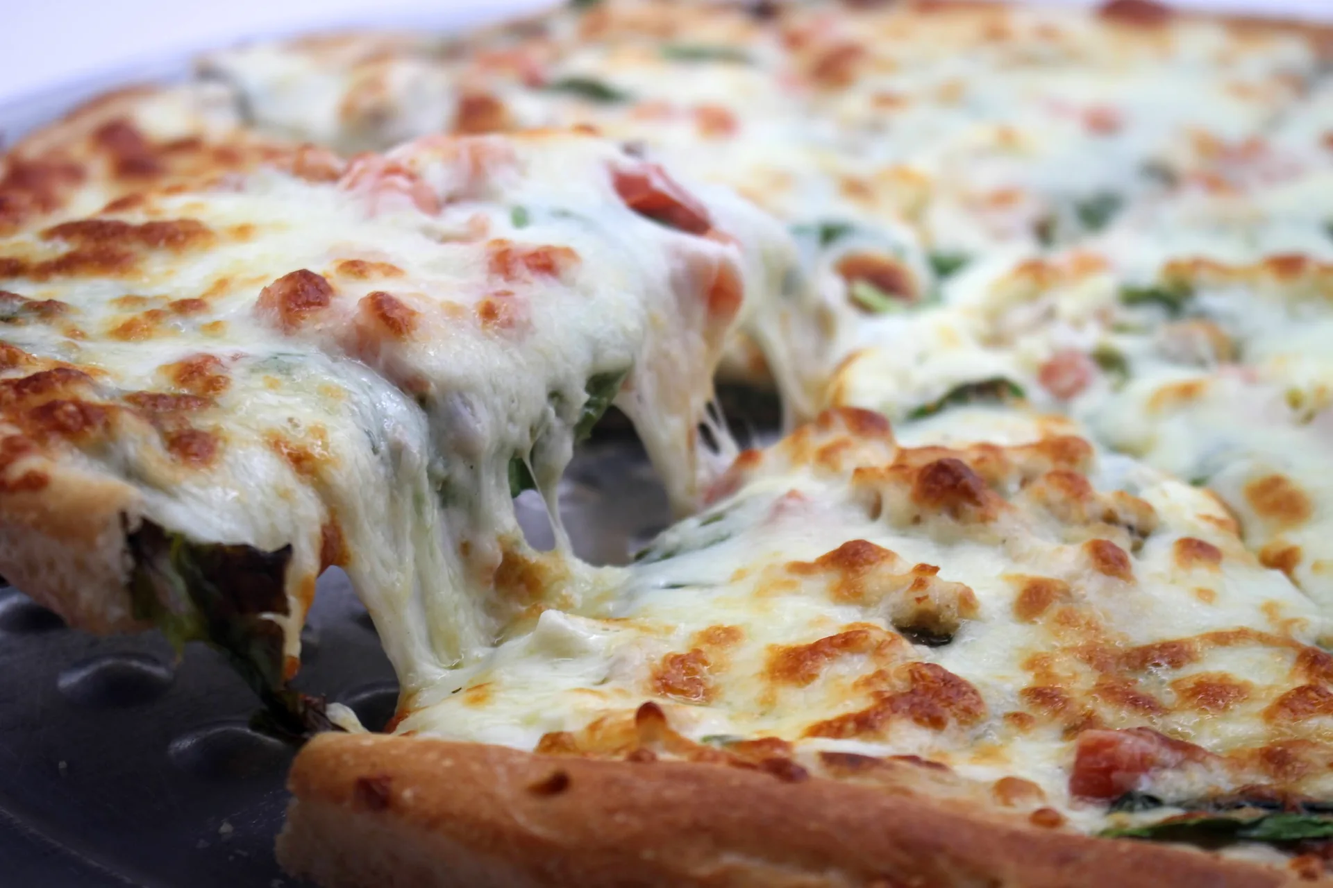 Greek-style pan pizza with spinach at Eleni's Pizza Works in Sarasota